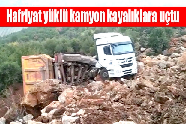 Hafriyat yüklü kamyon kayalıklara uçtu